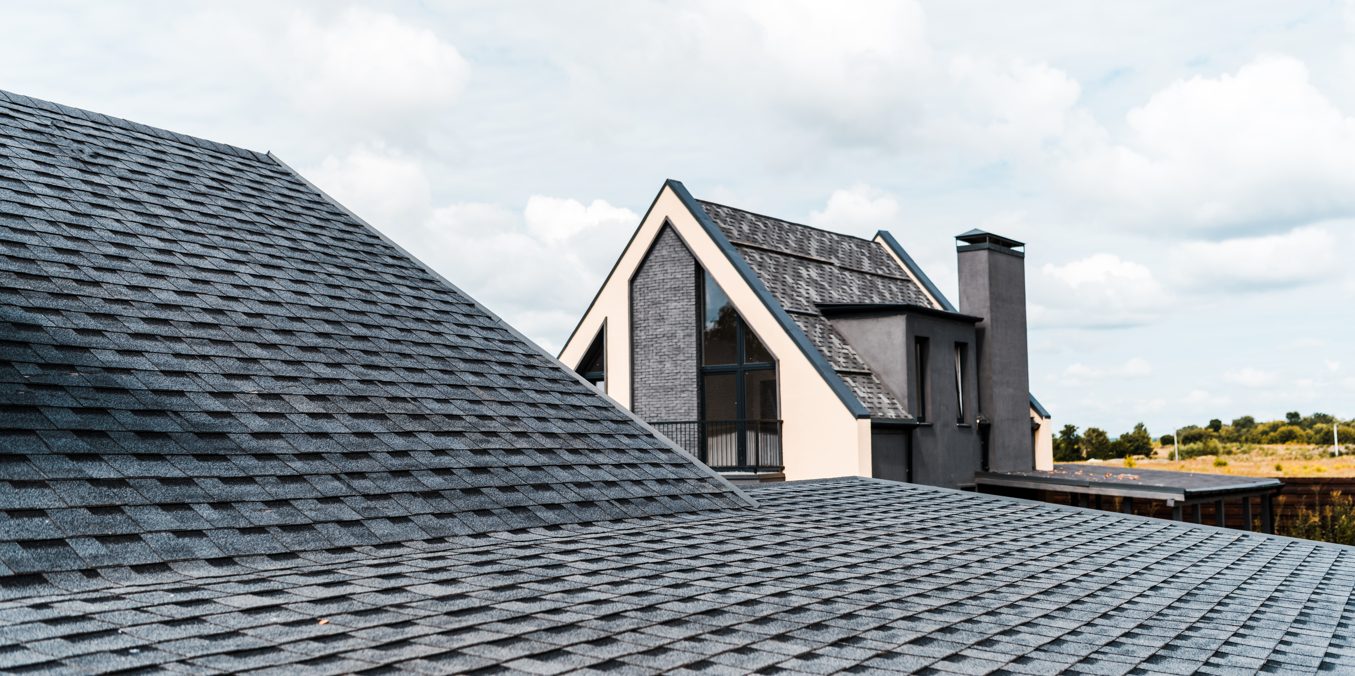 Grey roof shingles on a modern house